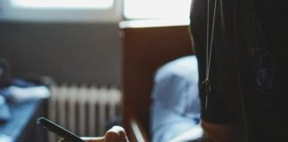 man holding black phone