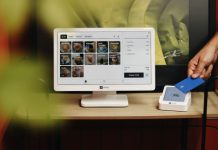 Unlocking Global Growth: Why Your Business Needs an International Payment Gateway A person is holding a credit card in front of a computer