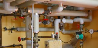 pipes and valves in a room with orange table