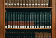 How to Compare Law Firms When You Need Representation books on brown wooden shelf