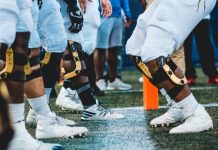 people in white and black jersey shirt and black shorts