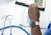 What Is Healthcare Fraud? a hand holding a smart watch