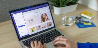a person typing on a laptop on a table