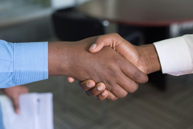 Photo by Cytonn Photography two person handshaking