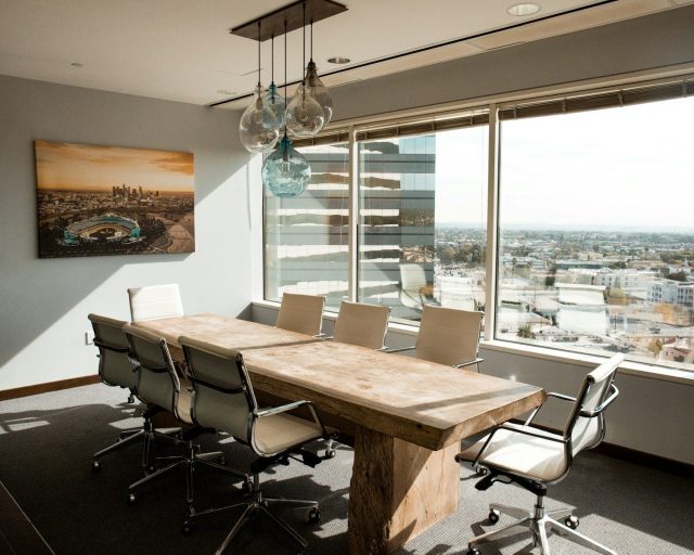 Photo by Dane Deaner beige wooden conference table