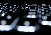 Data Sovereignty and Fintech: Building Secure Infrastructures for Niche Markets Close-up of a backlit keyboard in the dark.