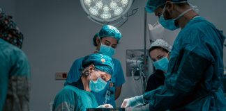 a group of doctors performing surgery on a patient